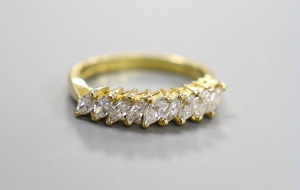 A modern 18ct gold and nine stone marquise cut diamond set half hoop ring, size O, gross weight 4.2 grams
